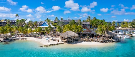 On the beach, free beach cabanas, beach towels, beach massages