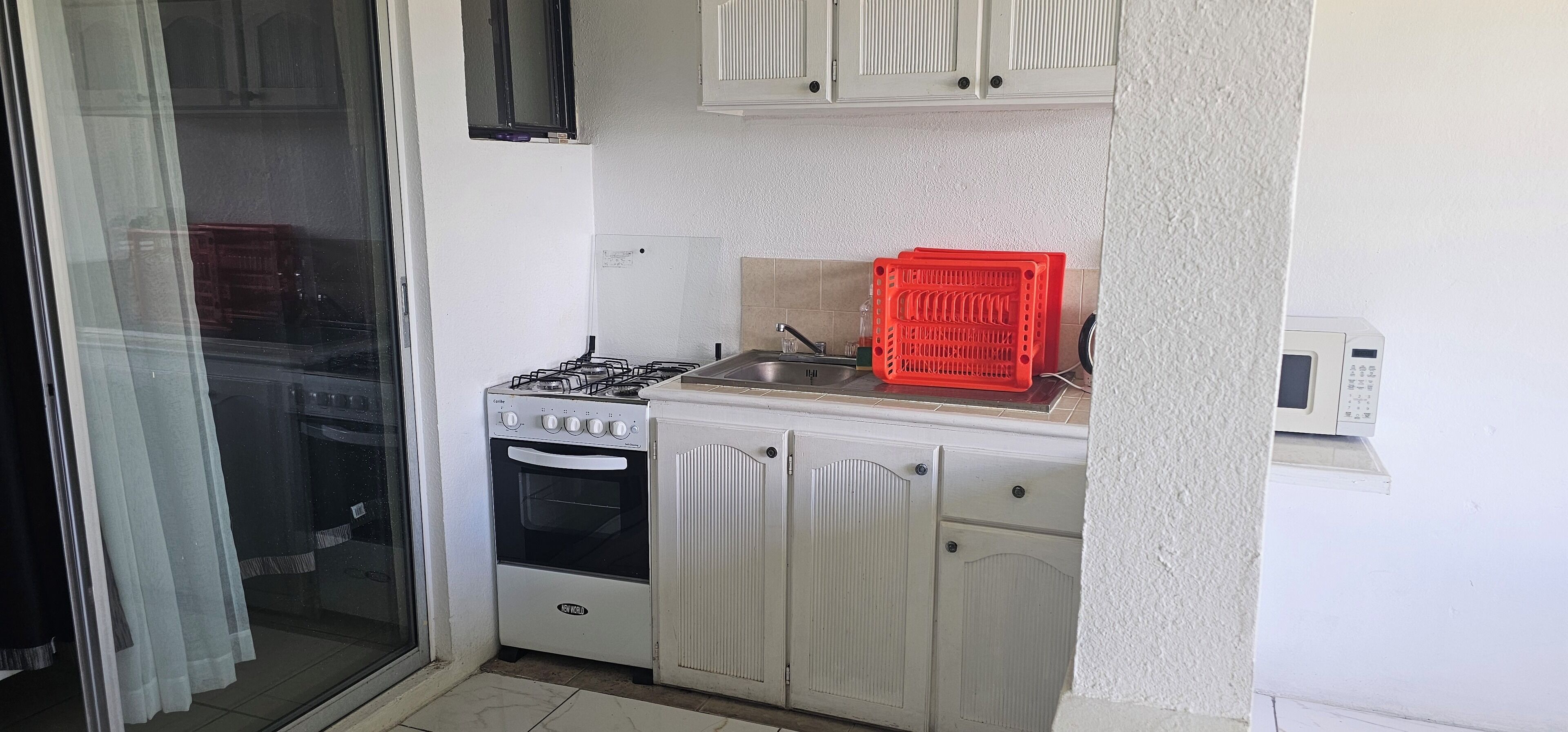 Comfort Apartment, 1 Queen Bed, Kitchenette, Sea View | Private kitchen | Full-size fridge, microwave, oven, stovetop