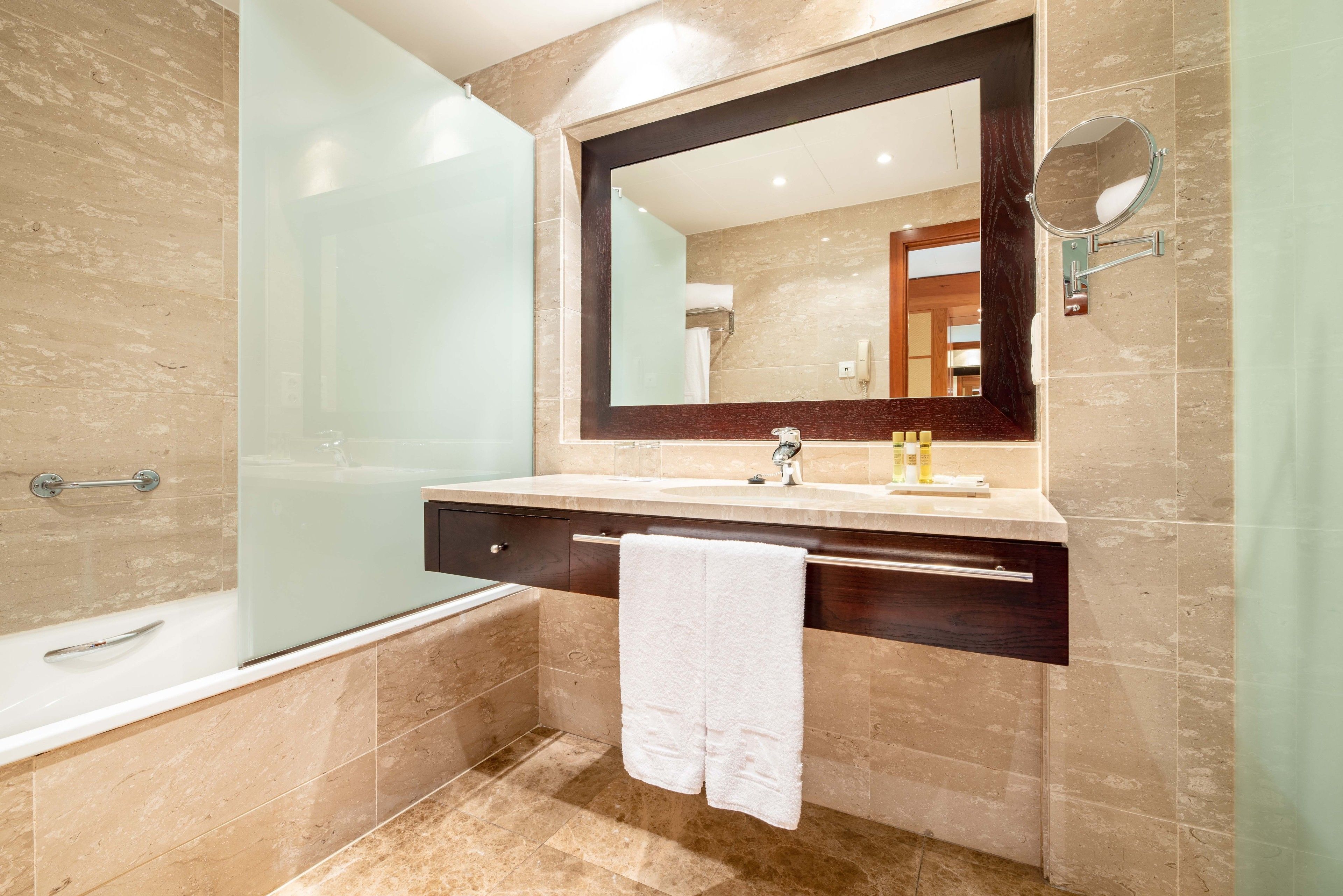 bathtub, eco-friendly toiletries, hair dryer, bathrobes