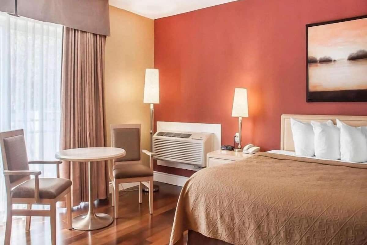 Desk, iron/ironing board, bed sheets, alarm clocks