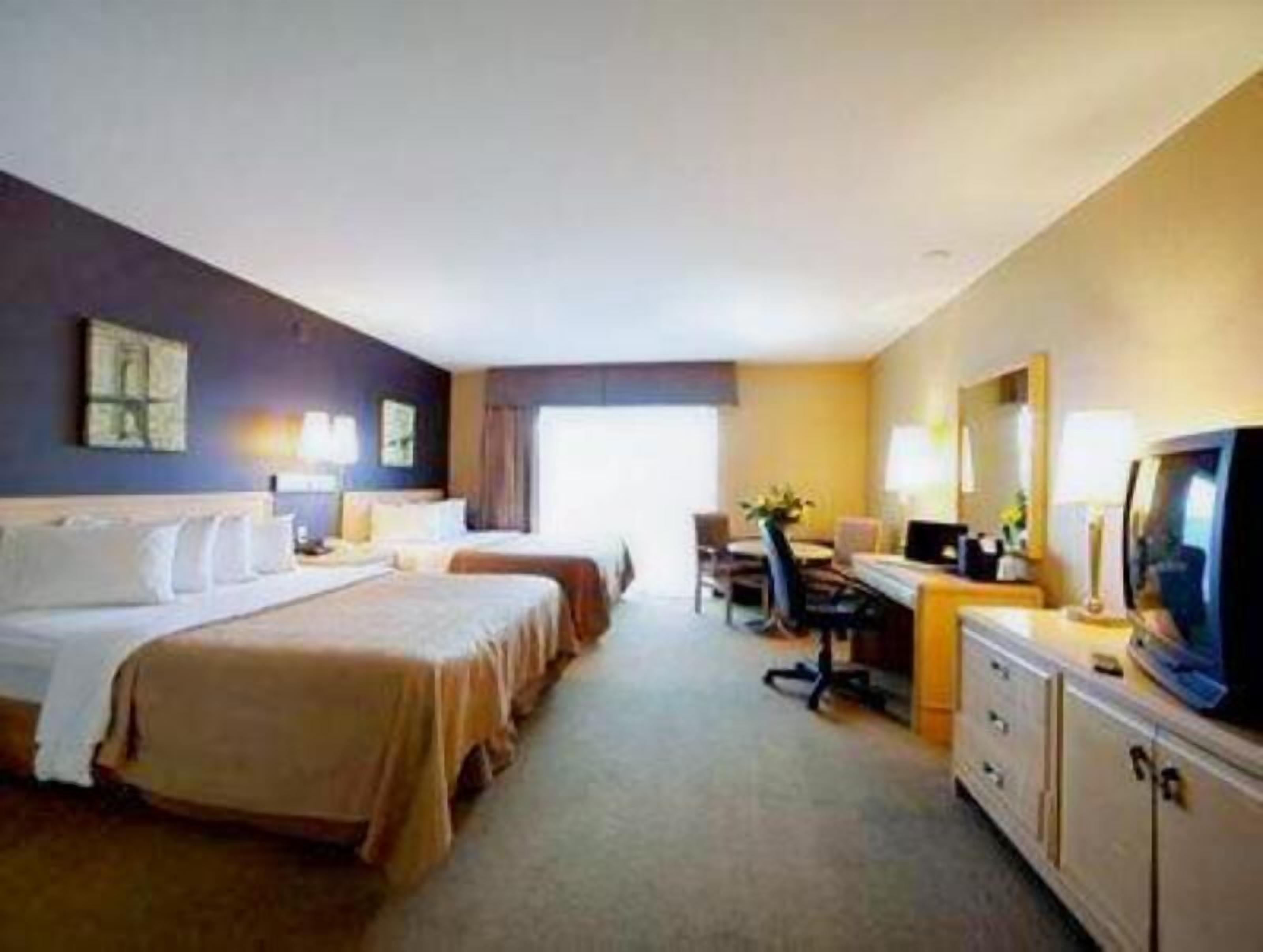 Desk, iron/ironing board, bed sheets, alarm clocks