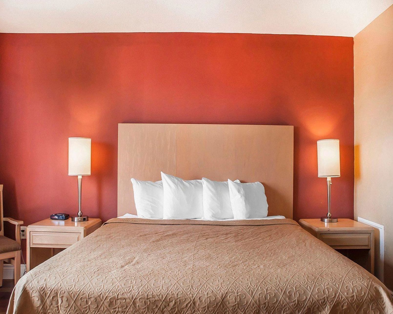 Desk, iron/ironing board, bed sheets, alarm clocks