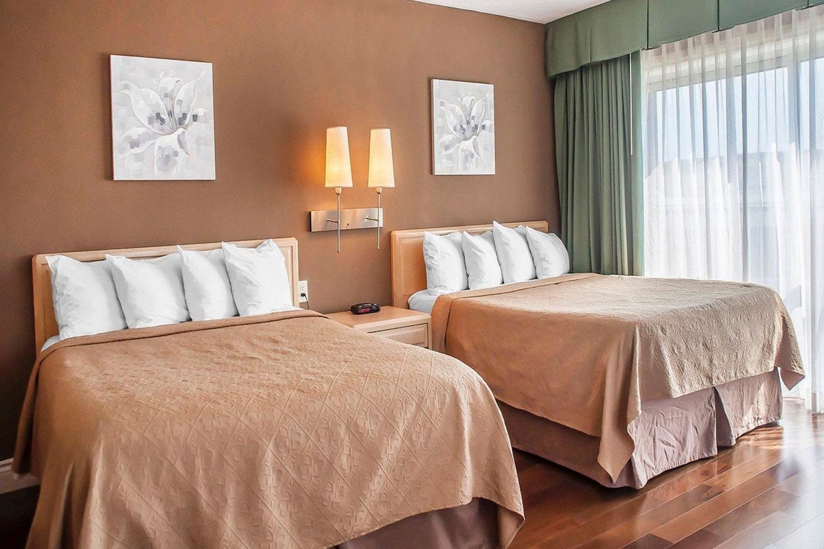 Desk, iron/ironing board, bed sheets, alarm clocks