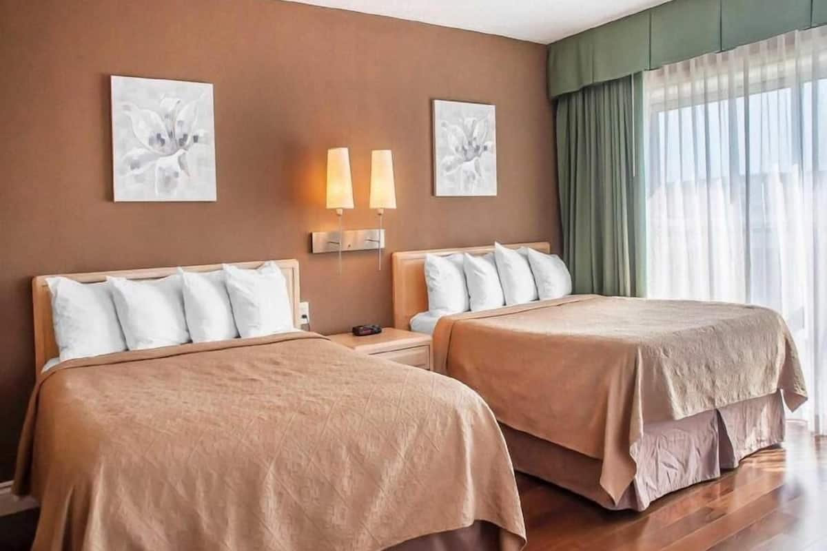 Desk, iron/ironing board, bed sheets, alarm clocks