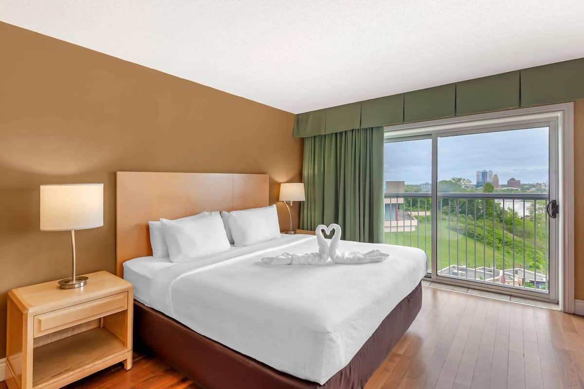 Desk, iron/ironing board, bed sheets, alarm clocks