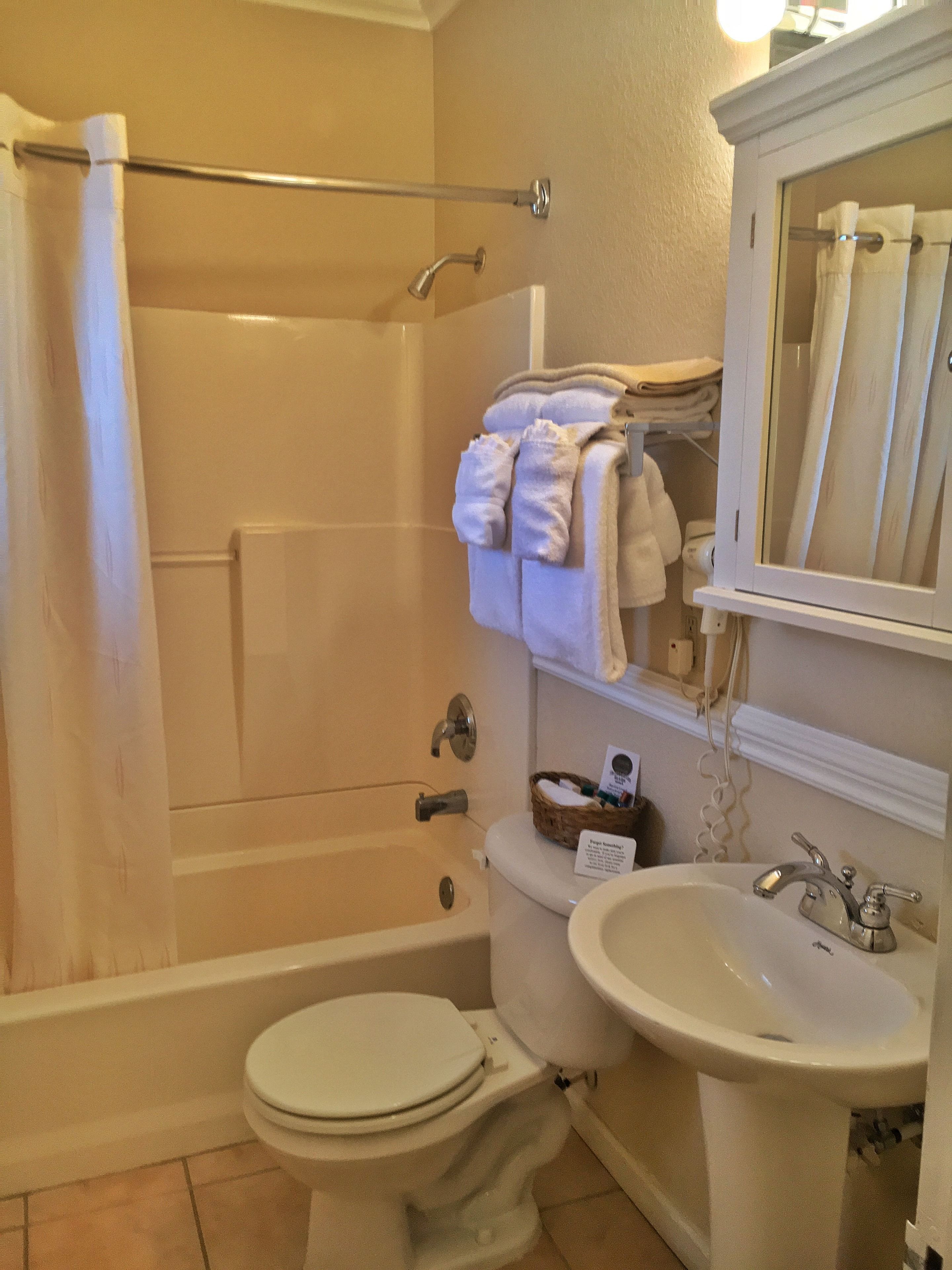 signature room, 2 queen beds, annex building (located beside the historic inn) | bathroom | free toiletries, hair dryer, towels