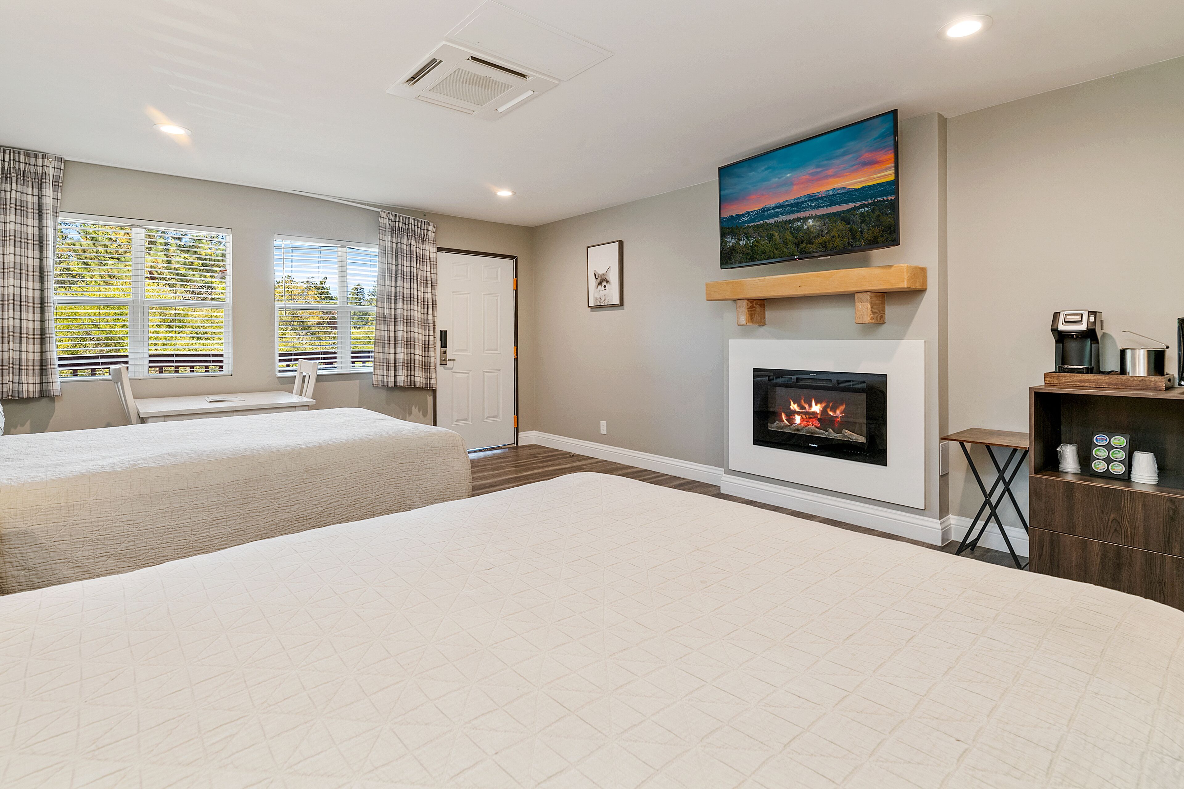 standard room, 2 queen beds, fireplace | television