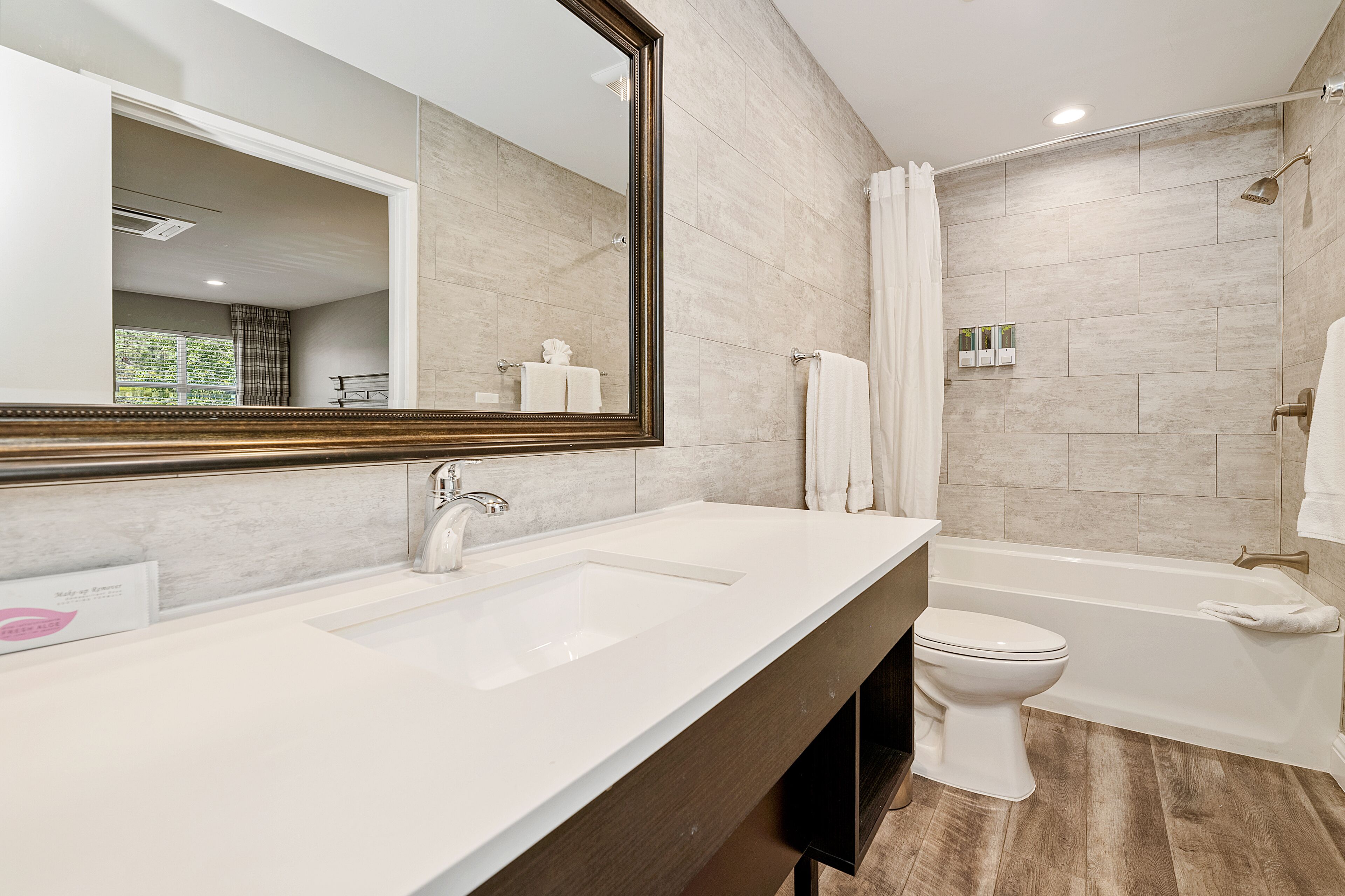 standard room, 2 queen beds, fireplace | bathroom | combined shower/bathtub, free toiletries, hair dryer, towels