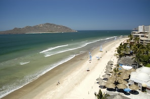 On the beach, beach umbrellas, 2 beach bars