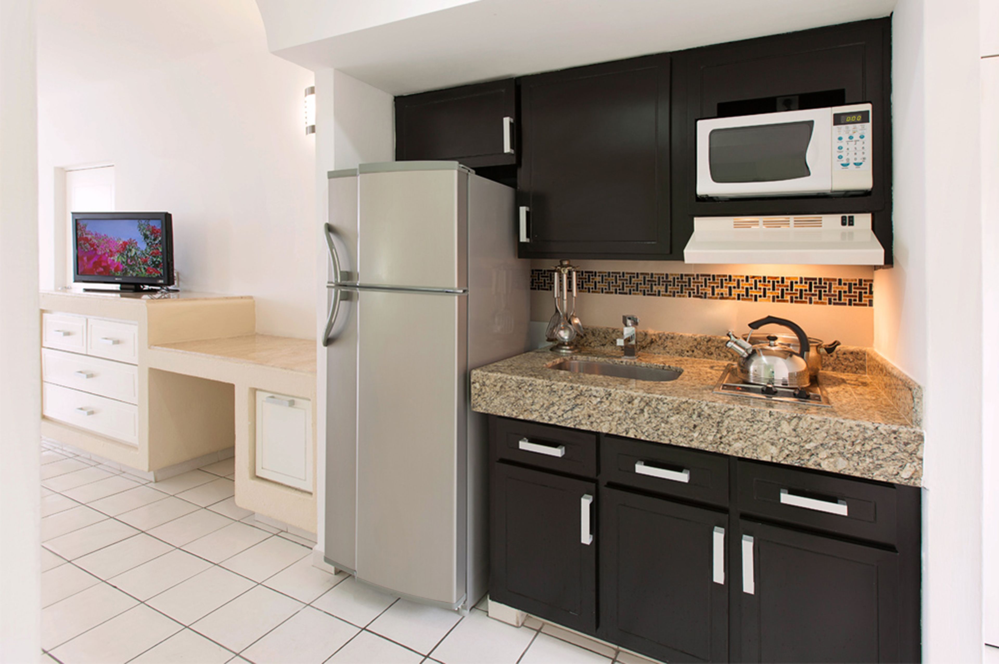 full-sized fridge, microwave, stovetop, coffee/tea maker