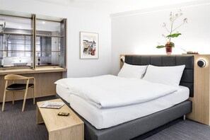 Premium bedding, down duvets, free minibar, in-room safe