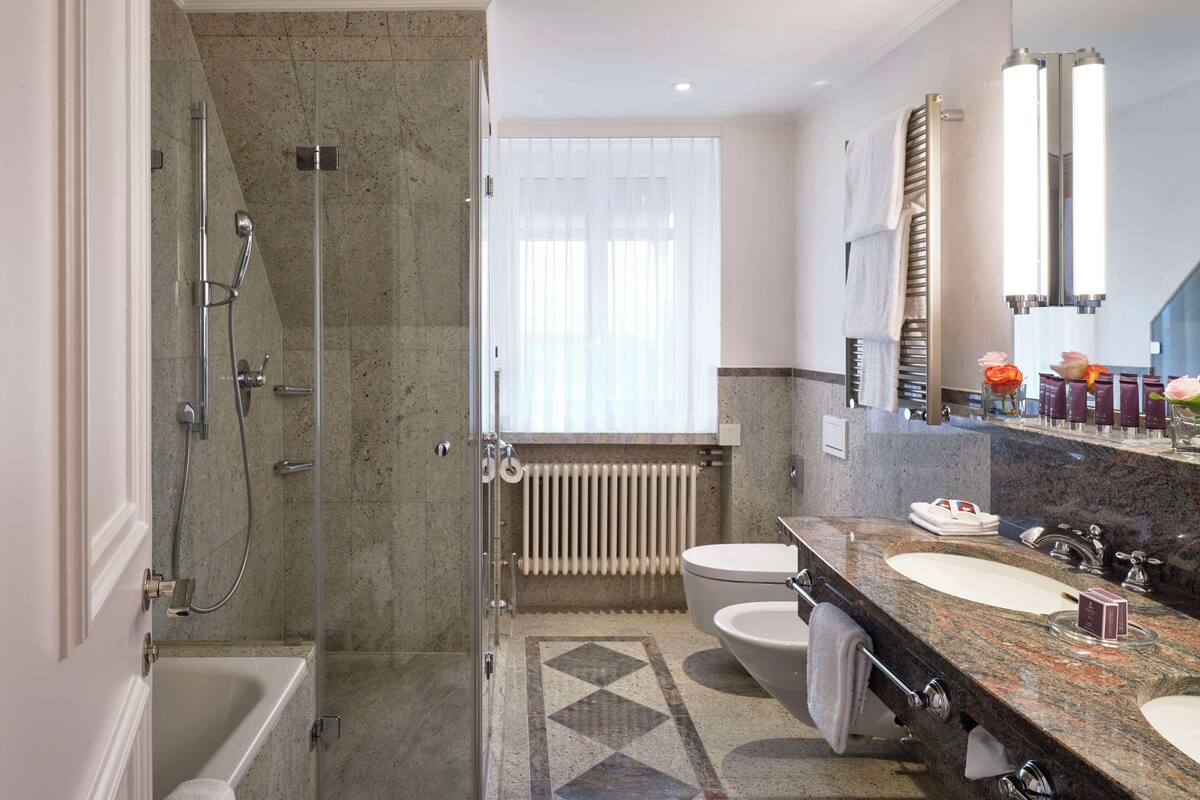 signature suite | bathroom | free toiletries, hair dryer, bathrobes, slippers