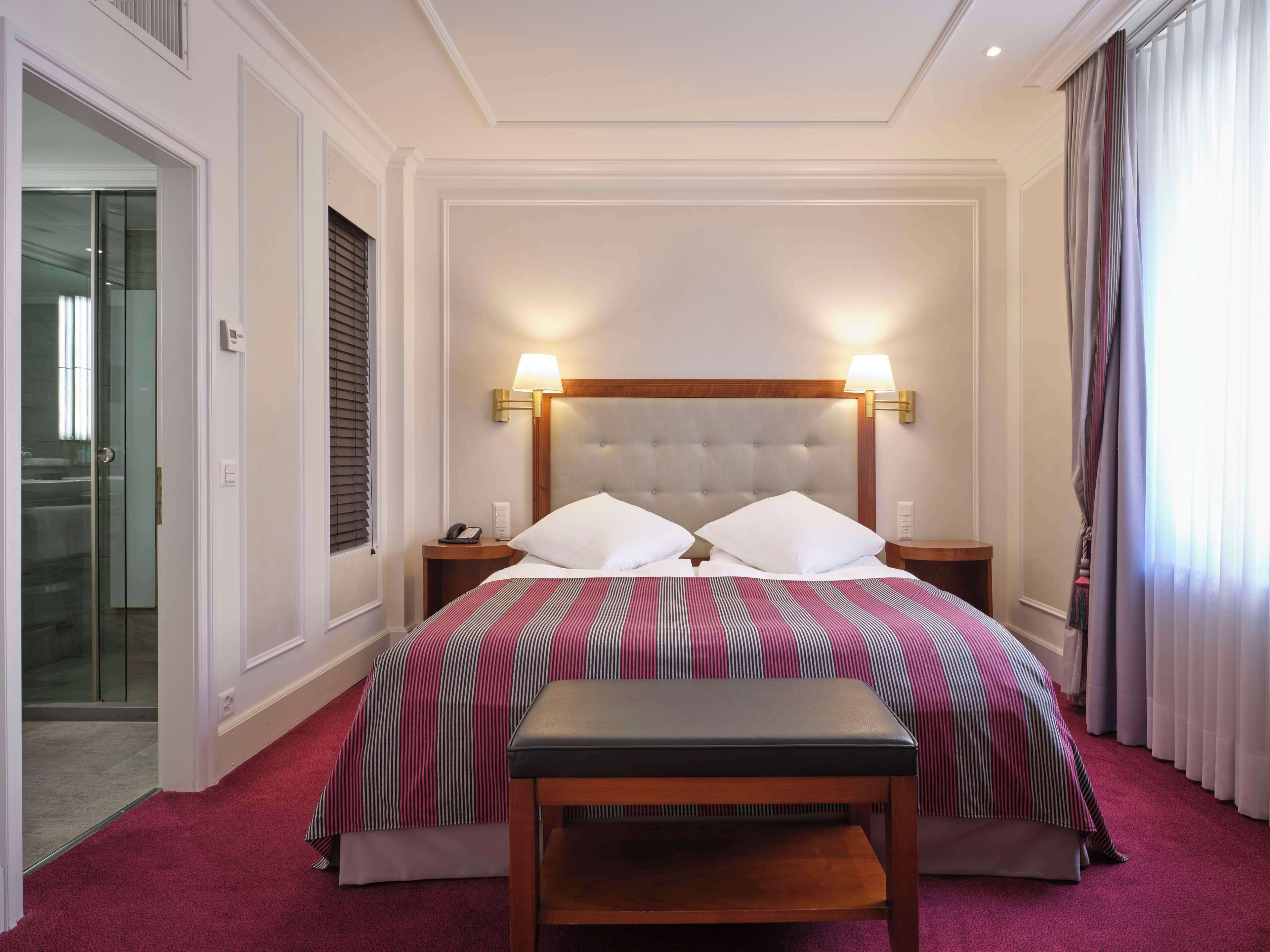 Premium bedding, minibar (some free items), in-room safe, desk