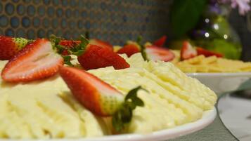 A dessert with strawberries on top.