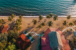 On the beach, white sand, beach towels, beach massages