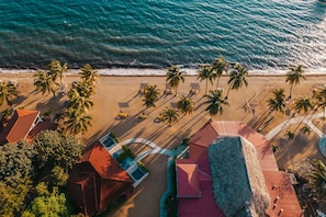 On the beach, white sand, beach towels, beach massages