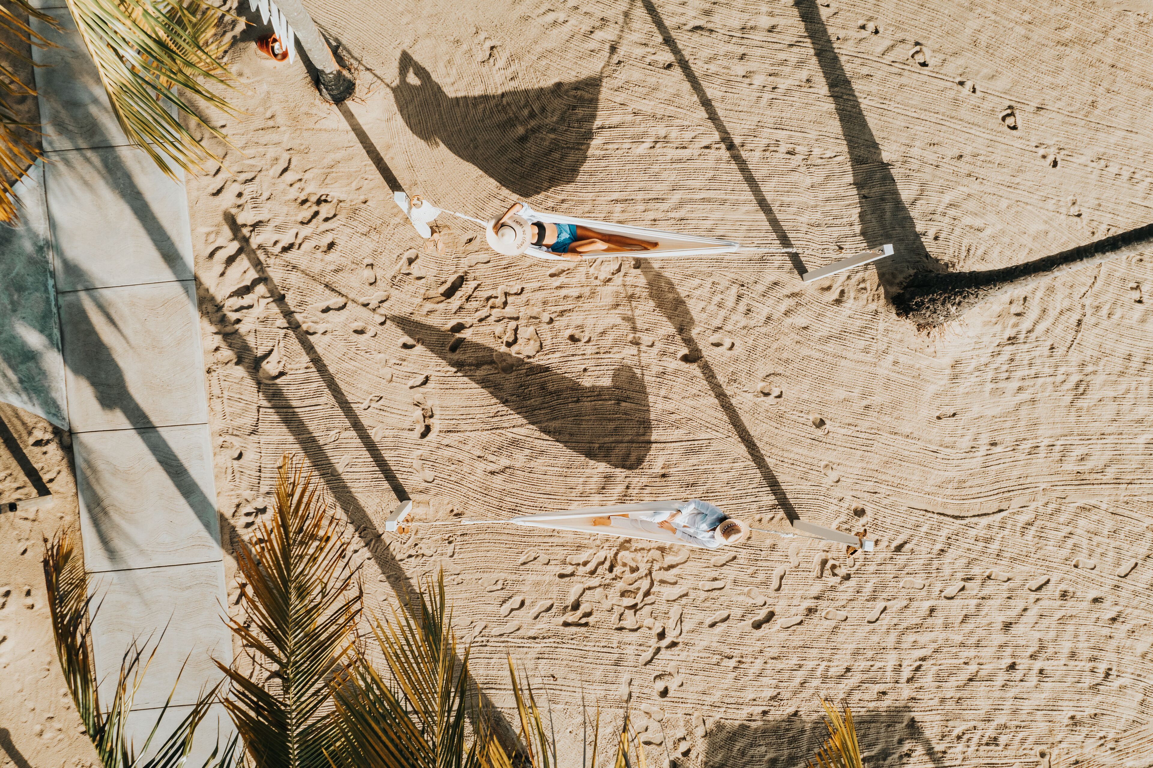 on the beach, white sand, beach towels, beach massages