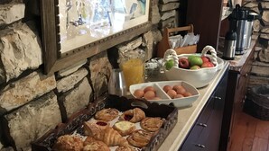 A breakfast buffet with pastries, fruits, and eggs. - Carmel Valley Lodge and Resort (Carmel Valley)