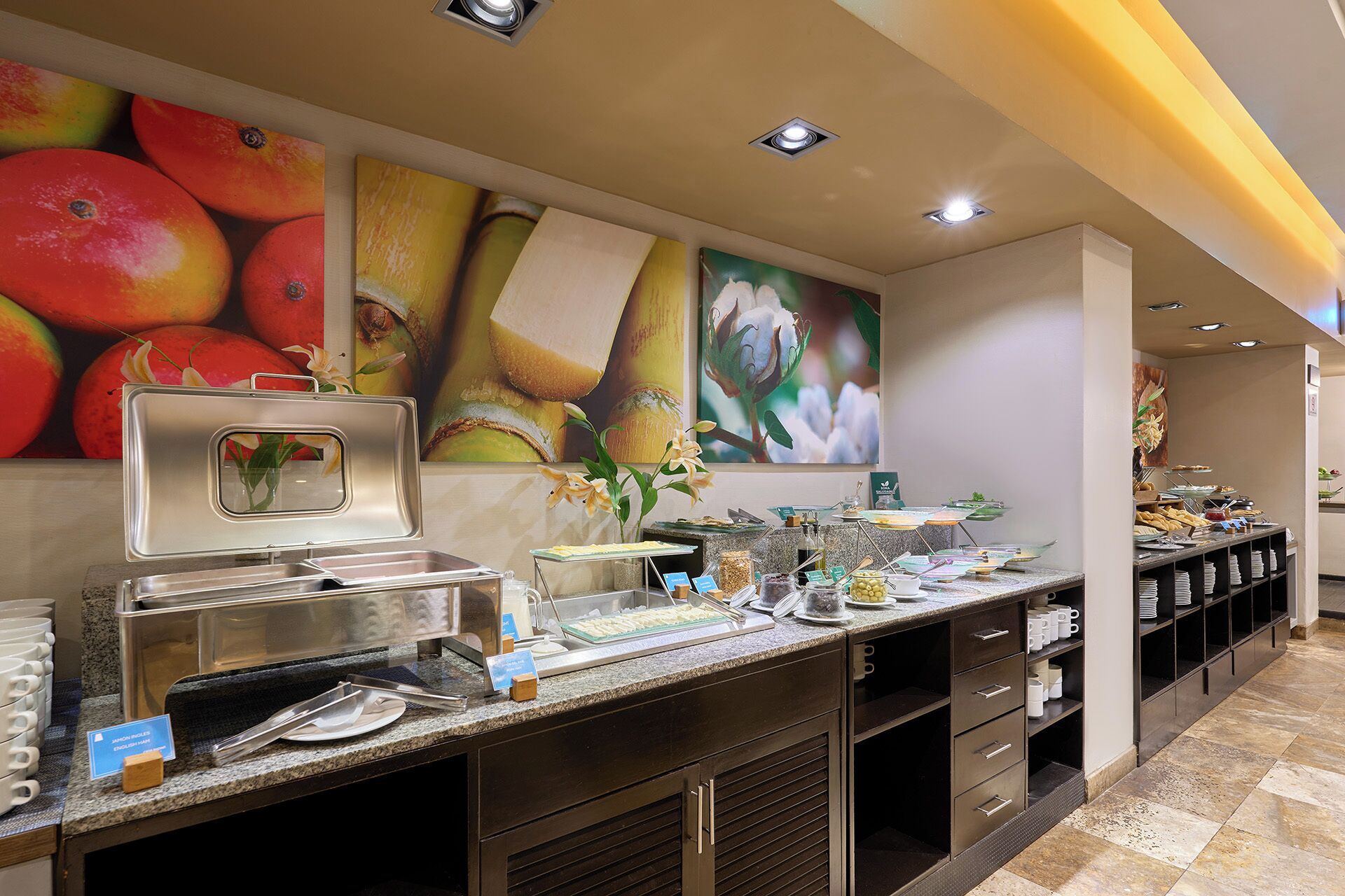 A buffet setup with various food items and a beverage station.