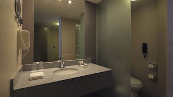Suite, 1 King Bed | Bathroom | Combined shower/tub, hair dryer, bathrobes, towels