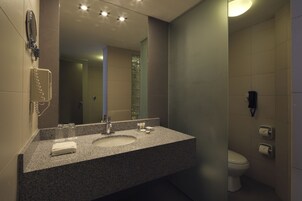 Suite, 1 King Bed | Bathroom | Combined shower/tub, hair dryer, bathrobes, towels