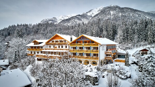Experience the charm of the Alps at this traditional hotel, surrounded by dense forested mountains.