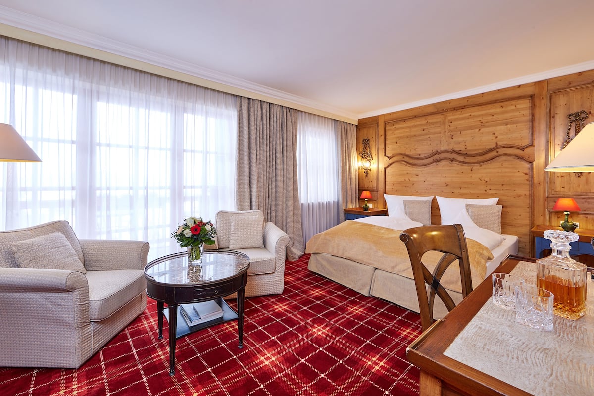 superior double room, balcony | living area | flat-screen tv, dvd player