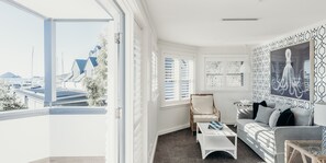 Villa | Living area | 36-inch TV with cable channels, pay films