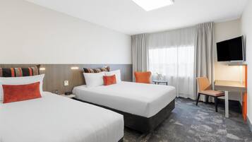 Premium bedding, down comforters, Select Comfort beds, in-room safe