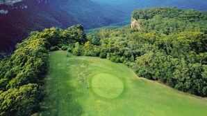 A lush green landscape with a golf course and surrounding forested hills. - Fairmont Resort Blue Mountains MGallery Collection (Leura)