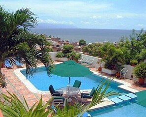 2 outdoor pools, pool umbrellas, pool loungers
