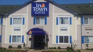 A two-story building with a sign reading "In Town Suites". - InTown Suites Extended Stay Clarksville (Clarksville)