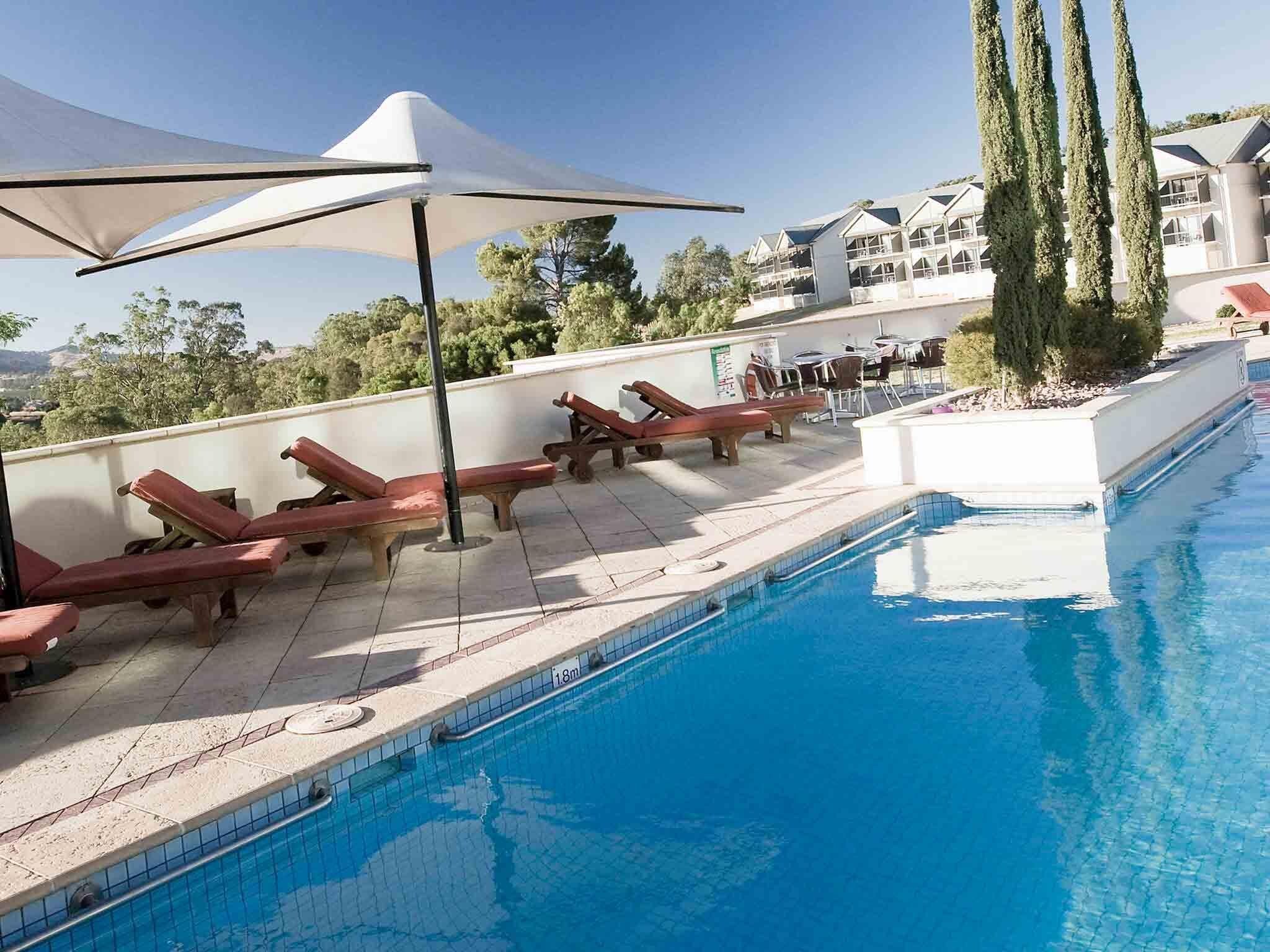 Outdoor pool, pool umbrellas, pool loungers