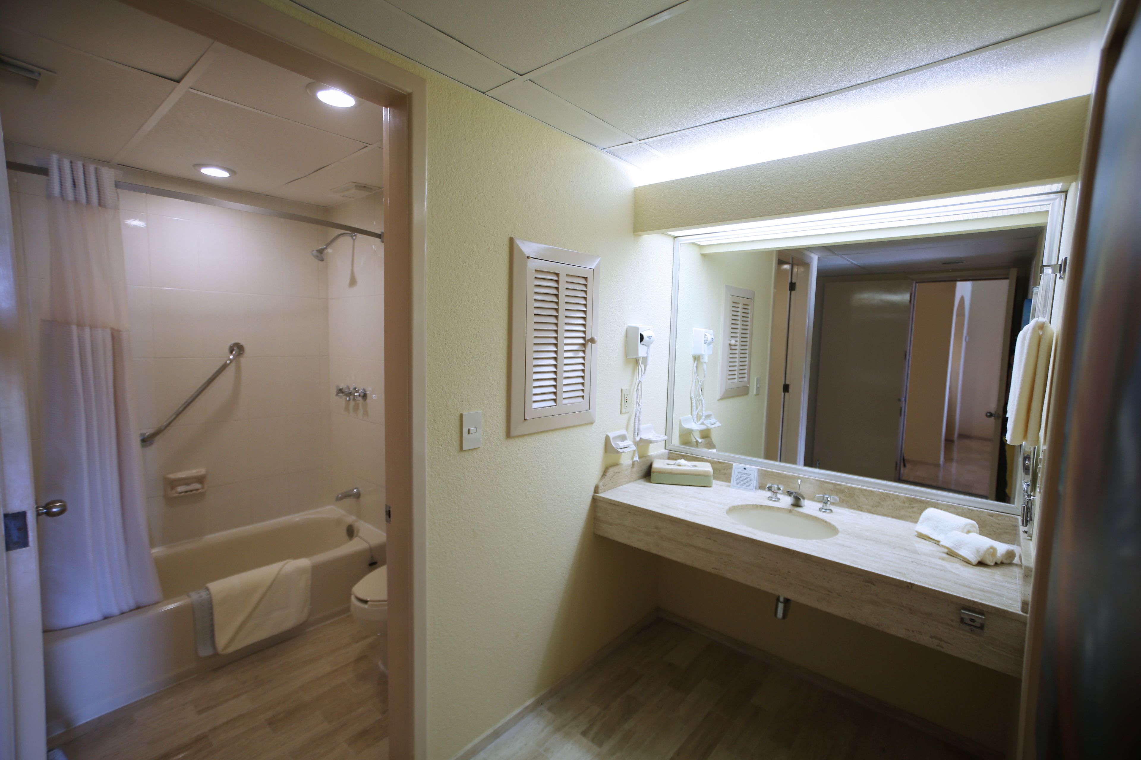combined shower/bathtub, eco-friendly toiletries, hair dryer, towels