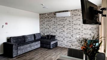 Family Apartment | Living area | 32-inch TV with cable channels, ping pong