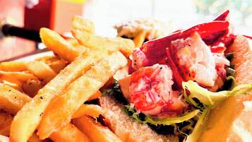 A sandwich with fries on a plate.
