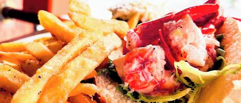 A sandwich with fries on a plate.