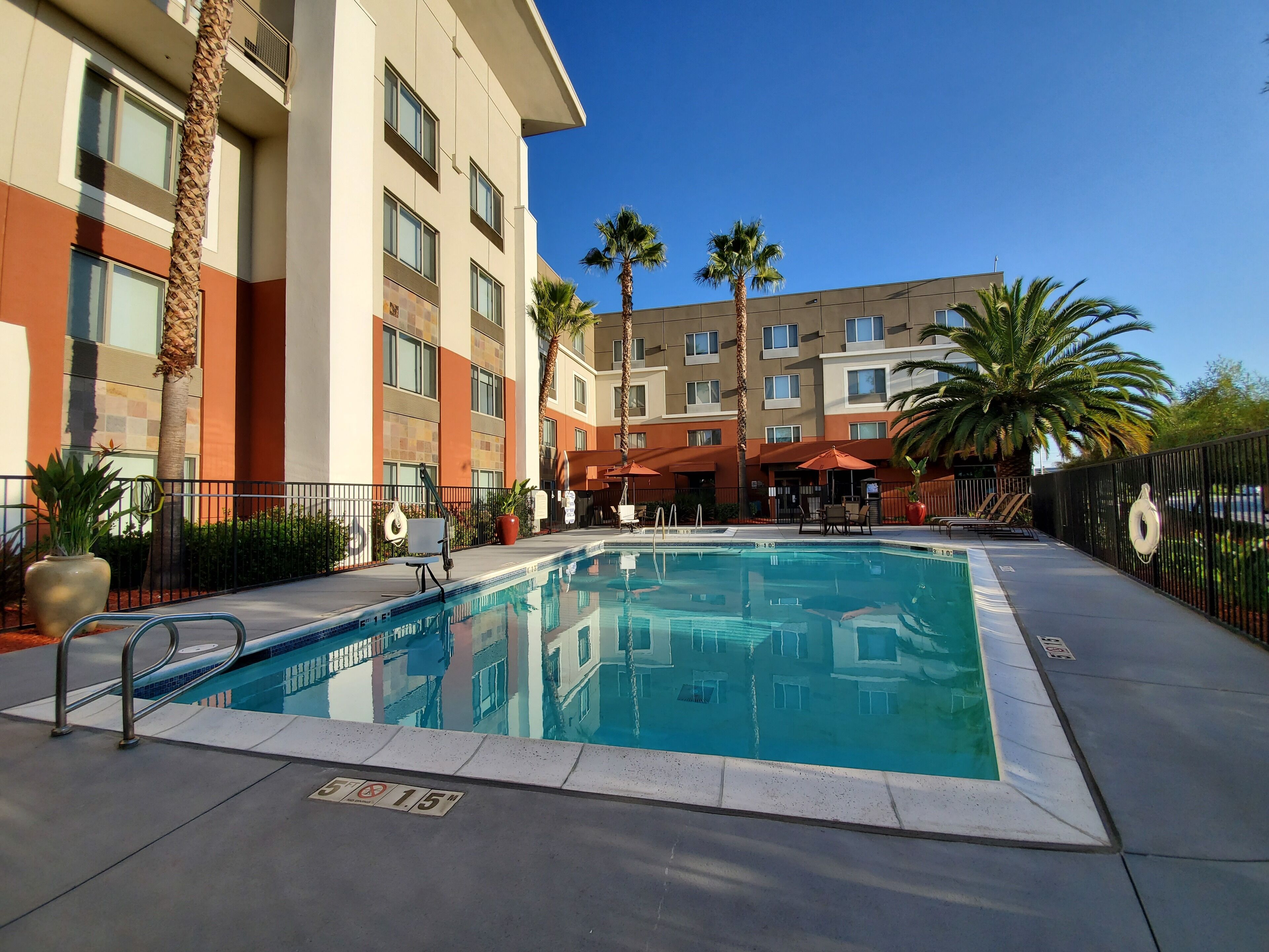 2 outdoor pools, open 7:00 am to 10:00 pm, pool umbrellas, pool loungers