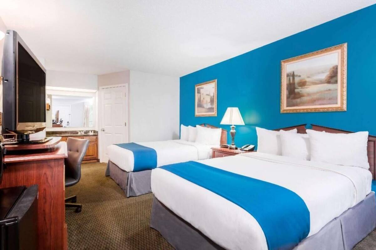 Pillow-top beds, desk, blackout curtains, iron/ironing board