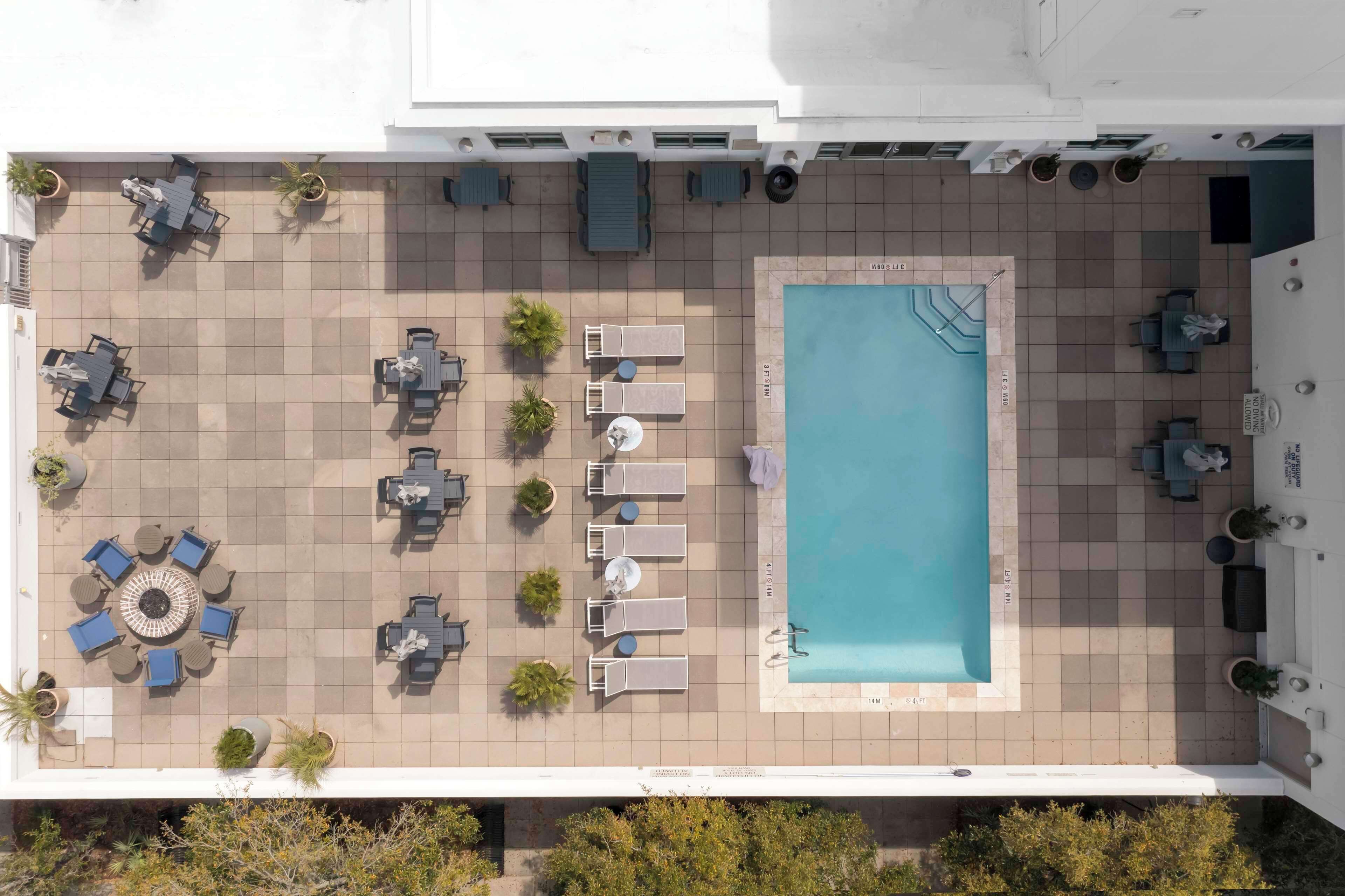 outdoor pool, open 9:00 am to 9:00 pm, pool umbrellas, pool loungers