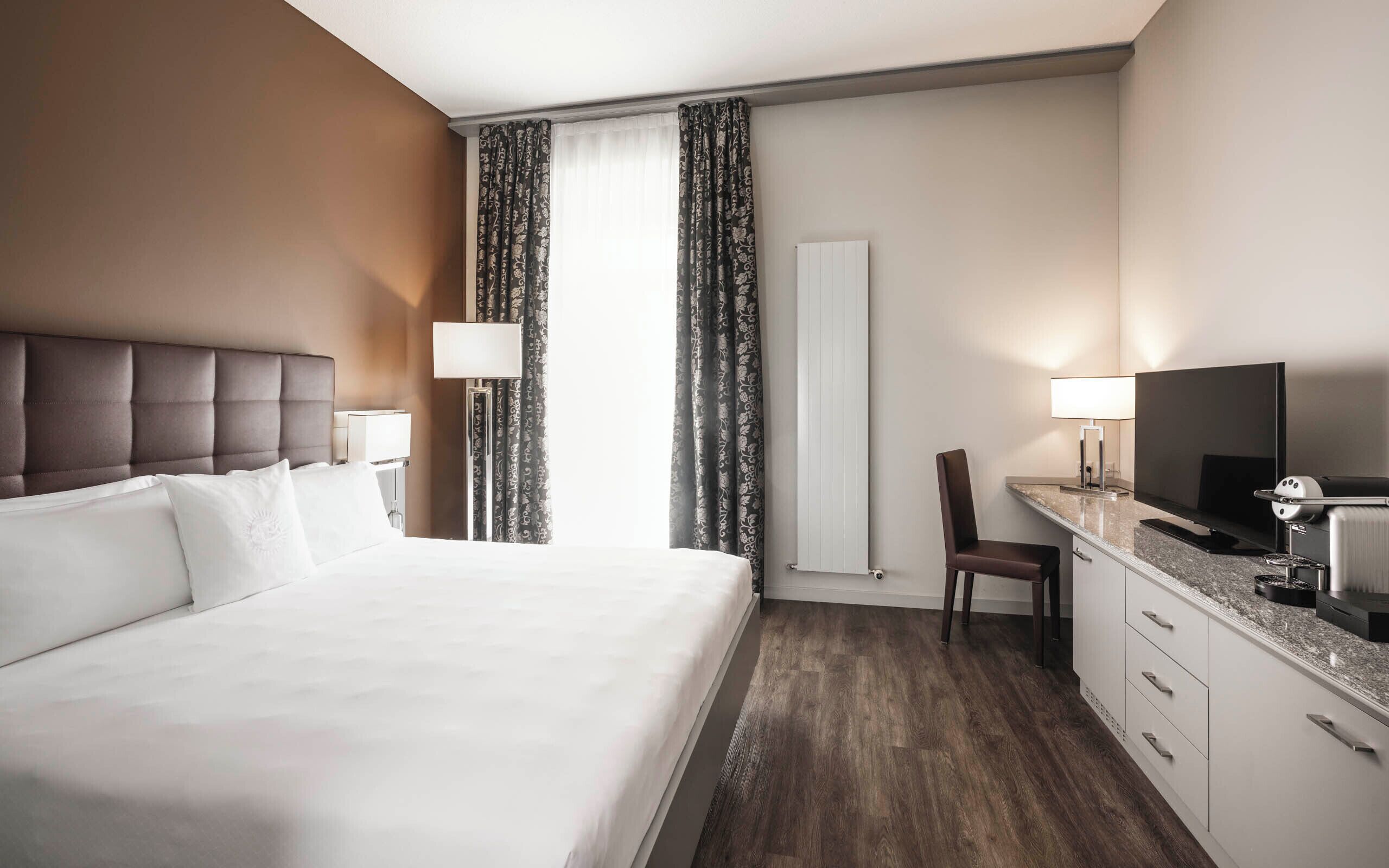 Premium bedding, down duvets, minibar, in-room safe