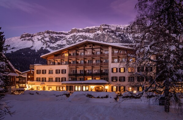 Experience the charm of the Alps from this hotel's upper-floor balcony, offering breathtaking views of the surrounding landscape.