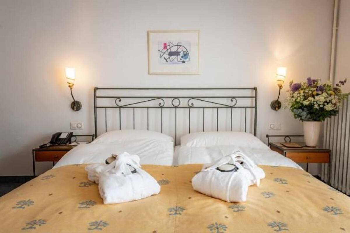 Hypo-allergenic bedding, free minibar, in-room safe, desk