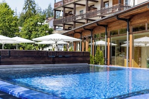 Indoor pool, outdoor pool, pool umbrellas, pool loungers