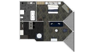 A hotel room layout with a bed, a sitting area with a sofa and a small table, a separate bathroom, and a dining area with a round table.
