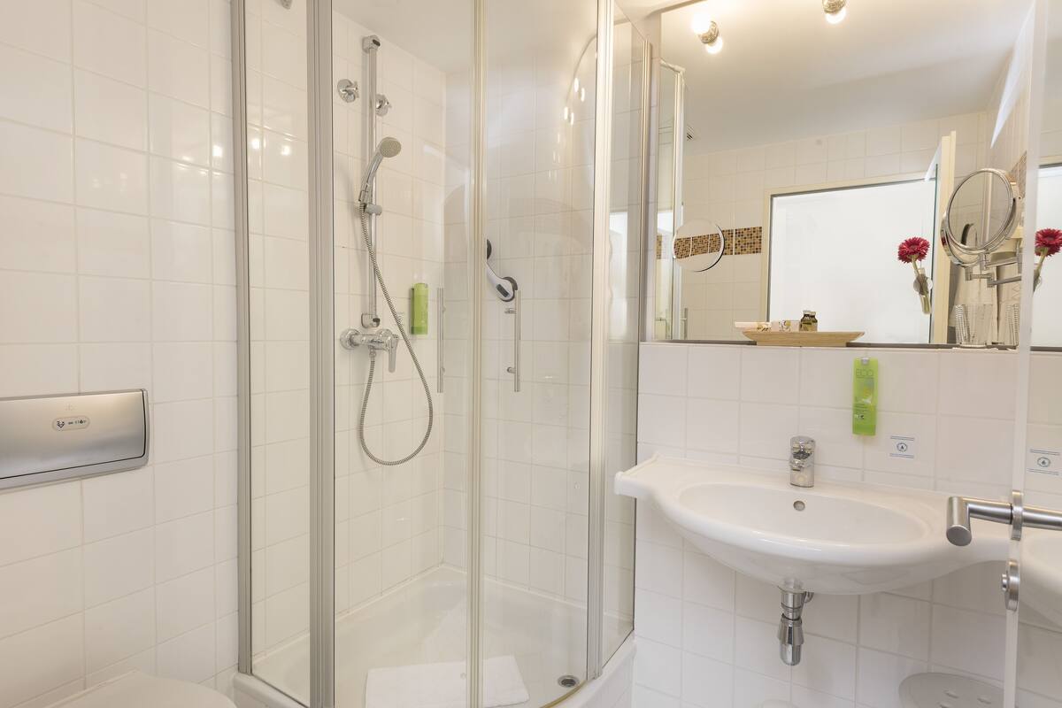 family room | bathroom | shower, free toiletries, hair dryer, towels