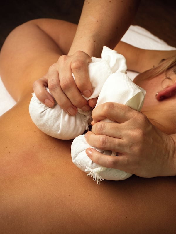 Experience a rejuvenating massage on a comfortable massage table.