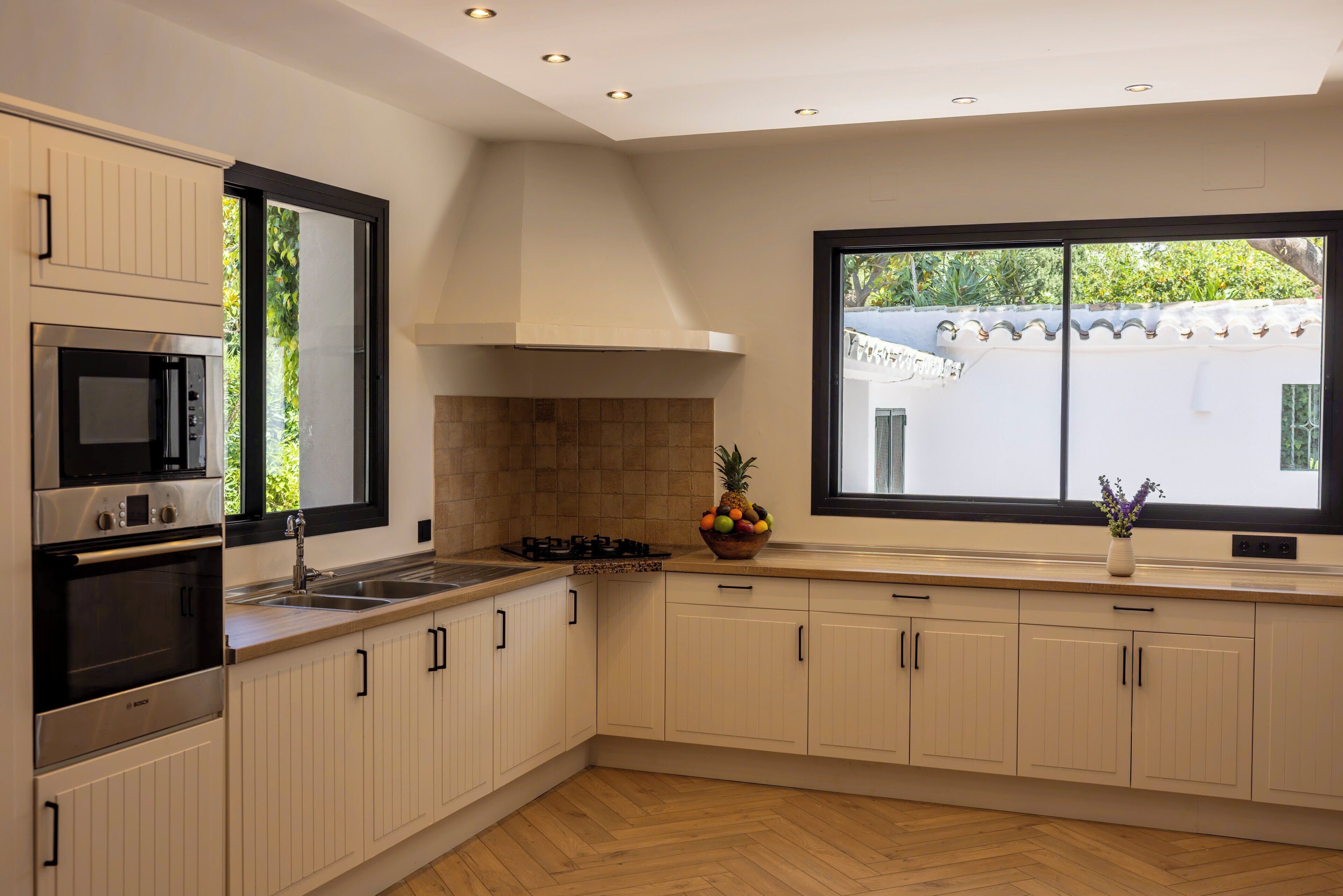 designer toiletries, hair dryer, bathrobes, slippers