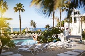 5 outdoor pools, open 10:00 AM to 7:00 PM, pool umbrellas, sun loungers