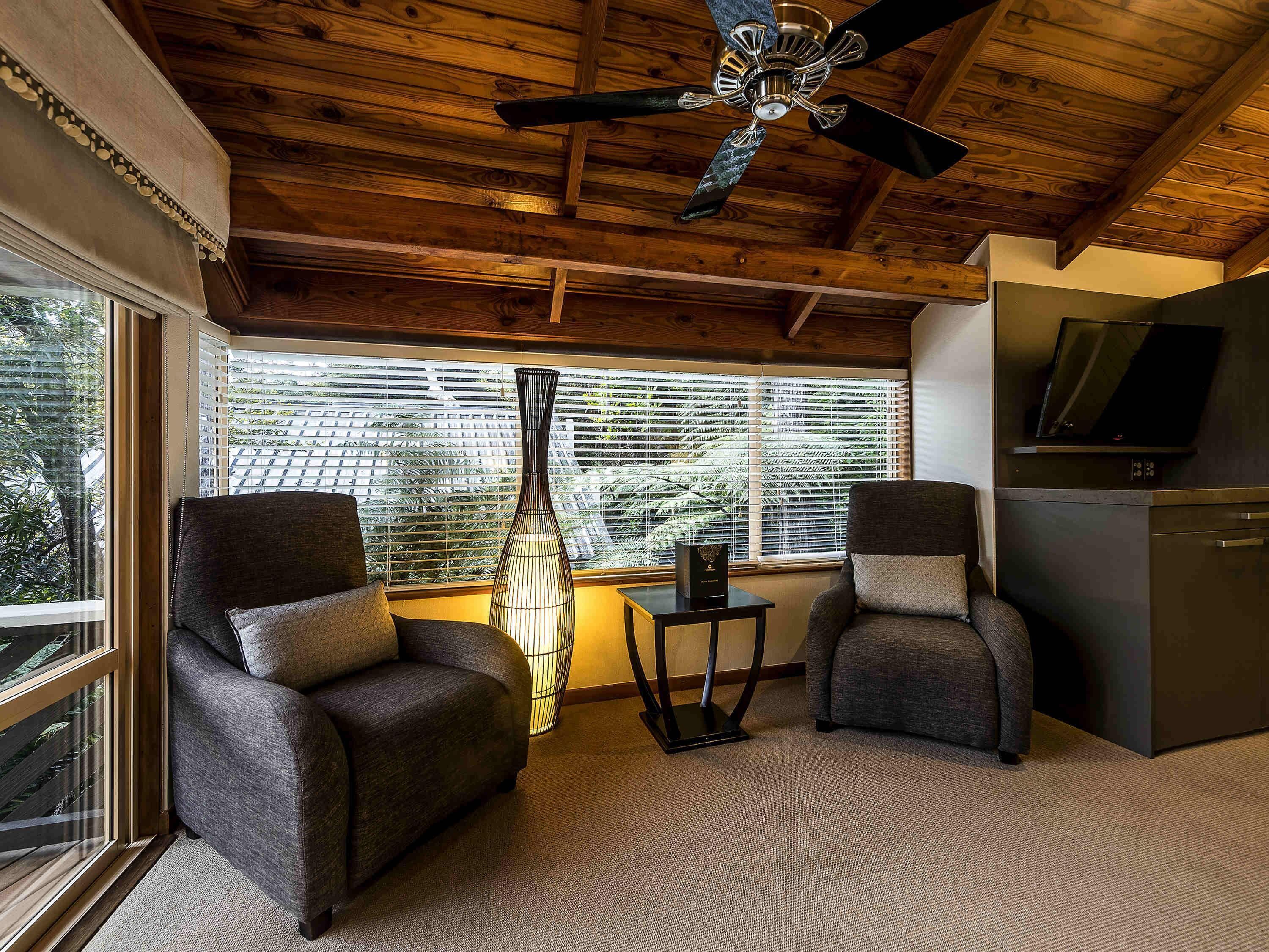 room, 1 king bed (tawa treehut) | 1 bedroom, in-room safe, desk, iron/ironing board